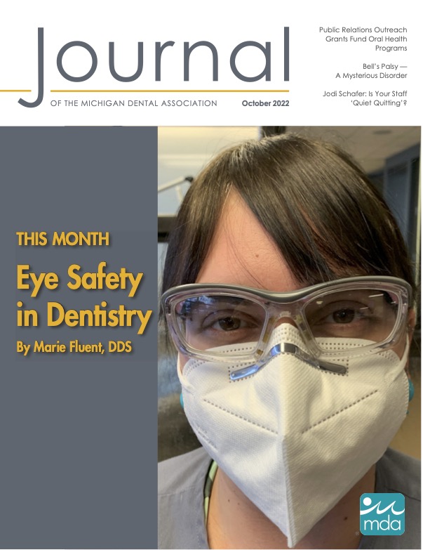 Cover of the Journal of the Michigan Dental Association with a close-up of a person wearing protective eyewear and an N95 facemask
