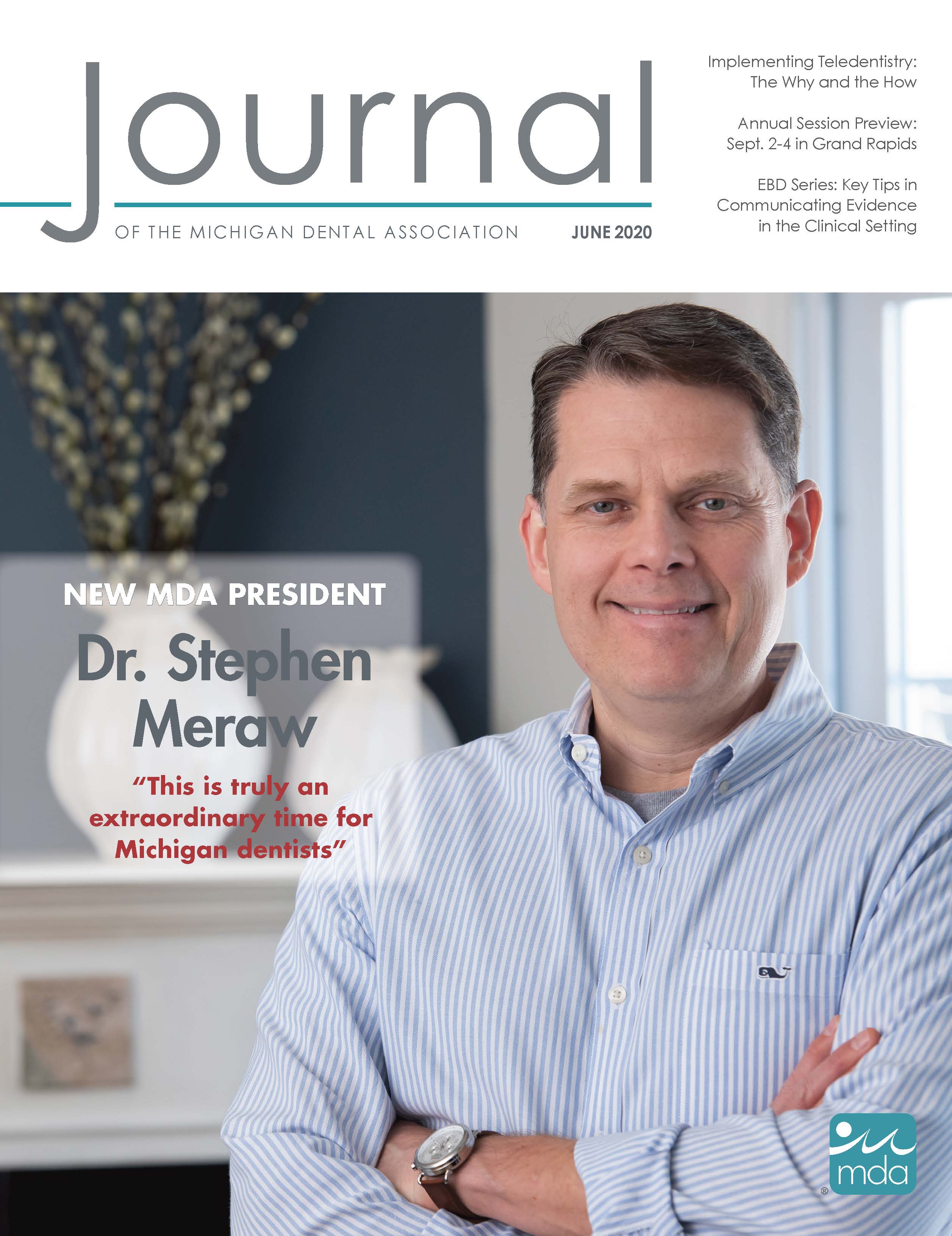 Cover of the Journal of the Michigan Dental Association with Dr. Meraw in business casual clothing, smiling at the camera with crossed arms.