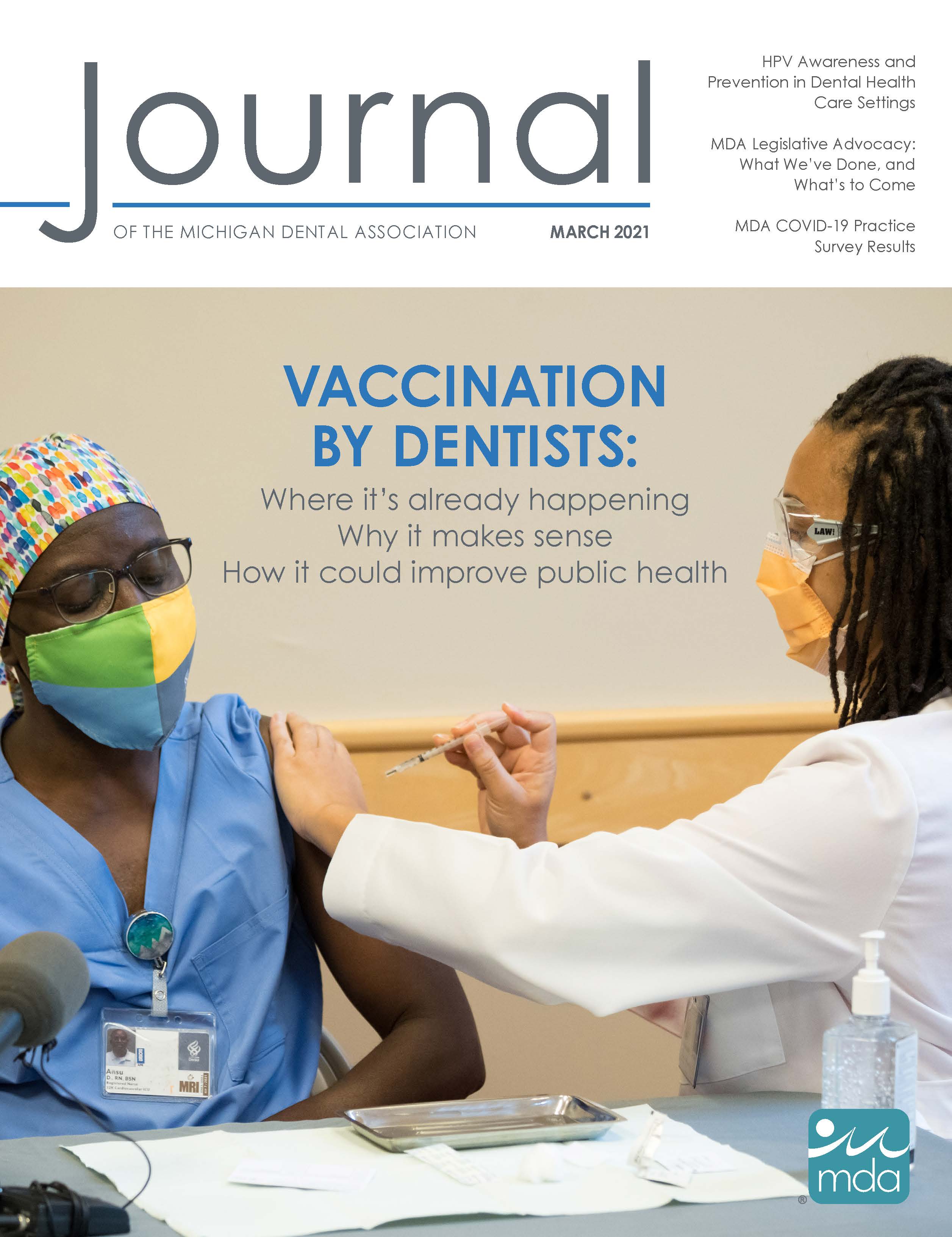 Cover of the Journal of the Michigan Dental Association with Dr. Ryan Thrower, the first dental resident ever to administer a COVID-19 vaccine, vaccinating Ansu Drammeh.