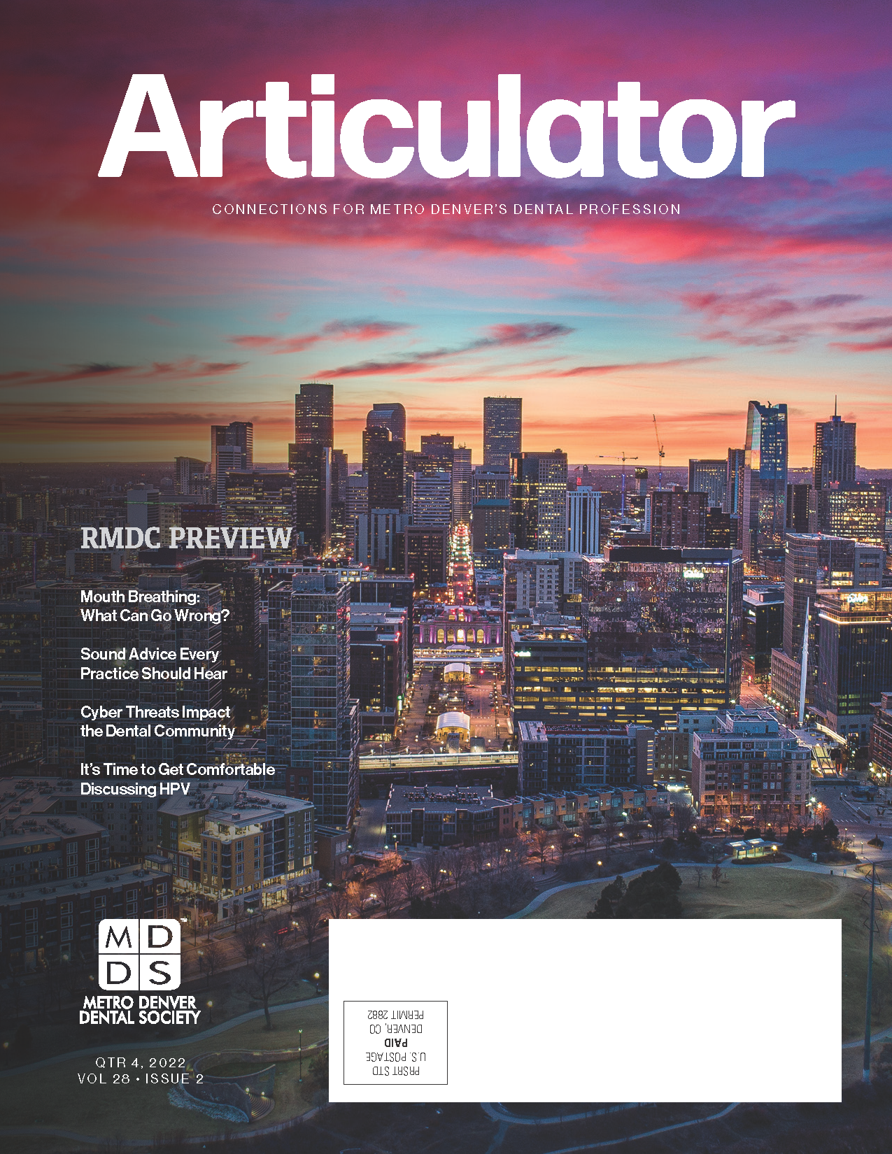 Cover of the Metro Denver Dental Society's Articulator magazine with photograph of the Denver skyline at sunset.