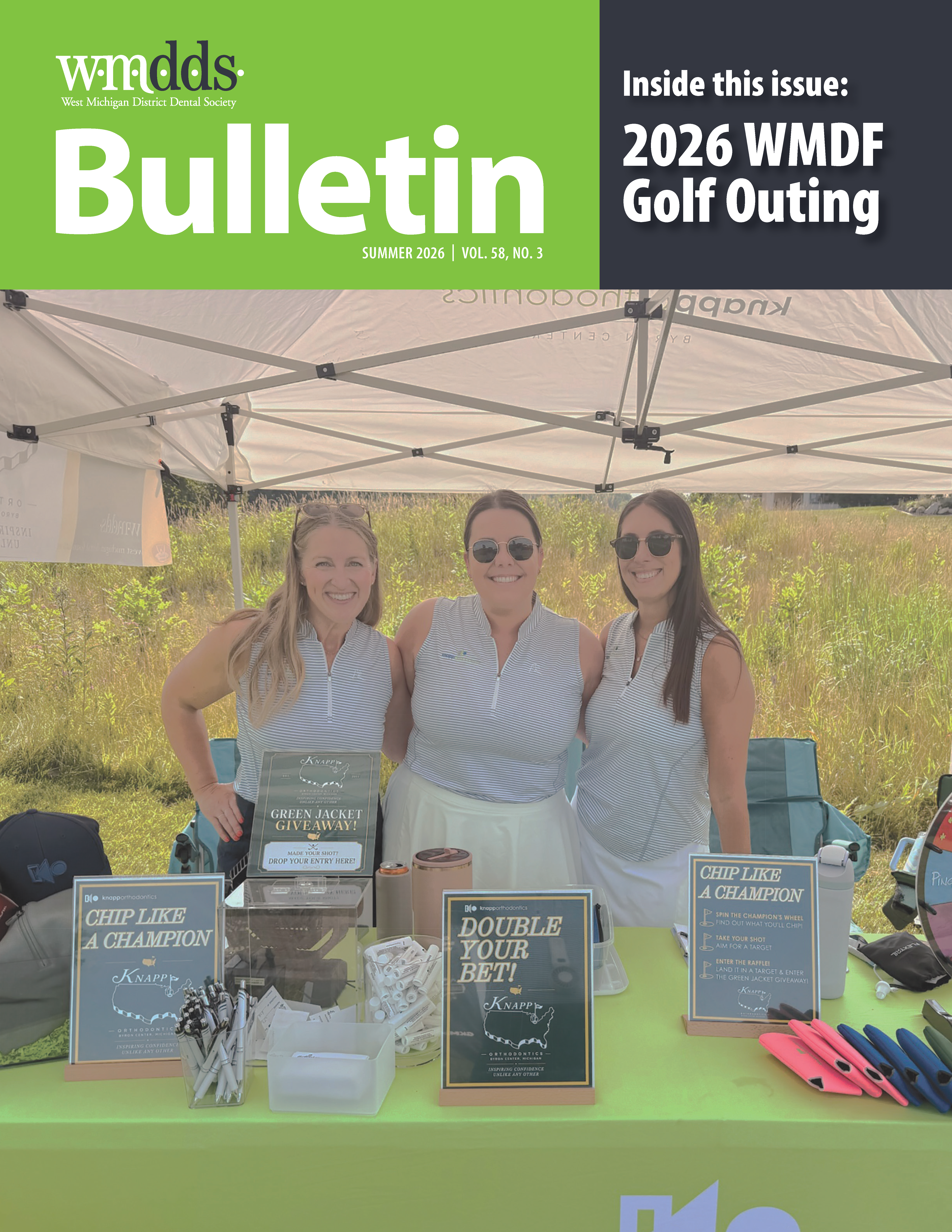 WMDDS cover with three women in golf outfits posing behind a merch table