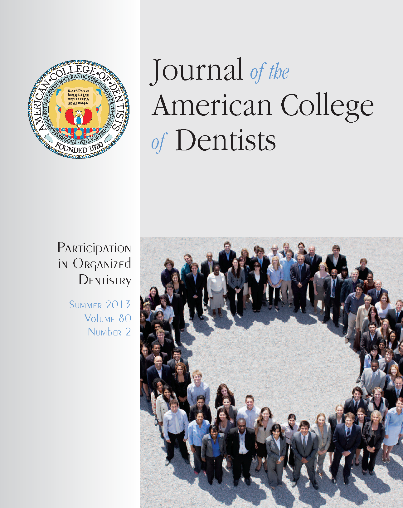 Photo of professionally dressed people standing in a ring, looking up at the camera