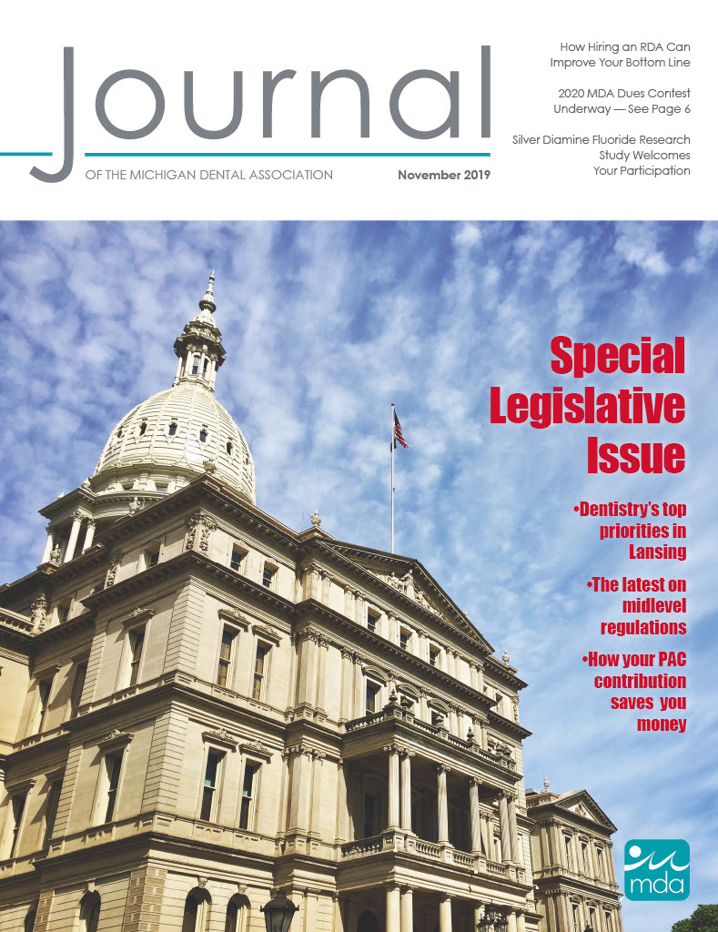 Cover of the Journal of the Michigan Dental Association featuring the Michigan State Capitol building.