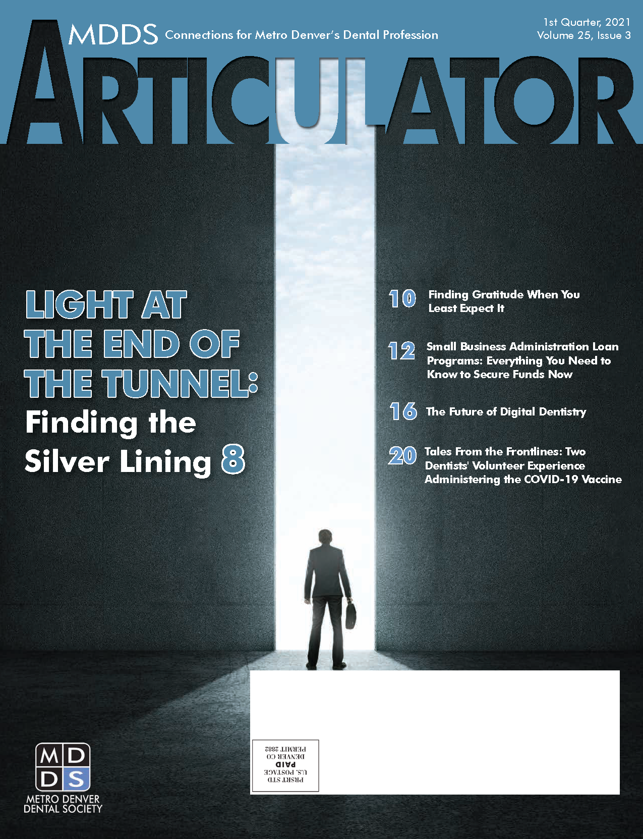 Cover of the Metro Denver Dental Society's Articulator magazine with image of a person in a suit carrying a briefcase standing in front of a brightly lit entrance between two tall walls.