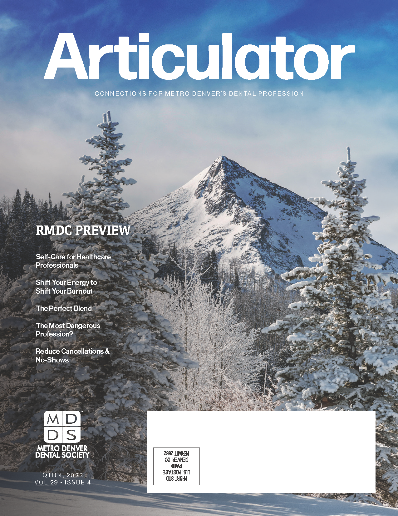 Cover of the Metro Denver Dental Society's Articulator magazine features a winter image of snow-covered mountains and pine trees.