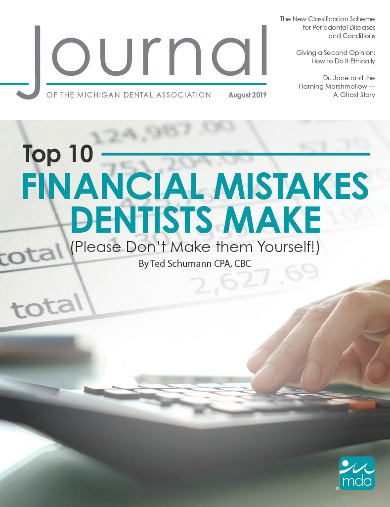 Cover of the Journal of the Michigan Dental Association with a close up of a person’s hand using a calculator and a blurry invoice in the background.