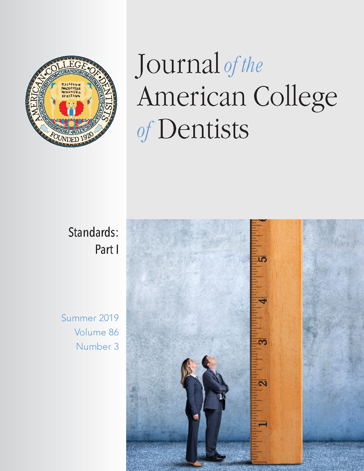 Photo of two professionals looking up at a ruler