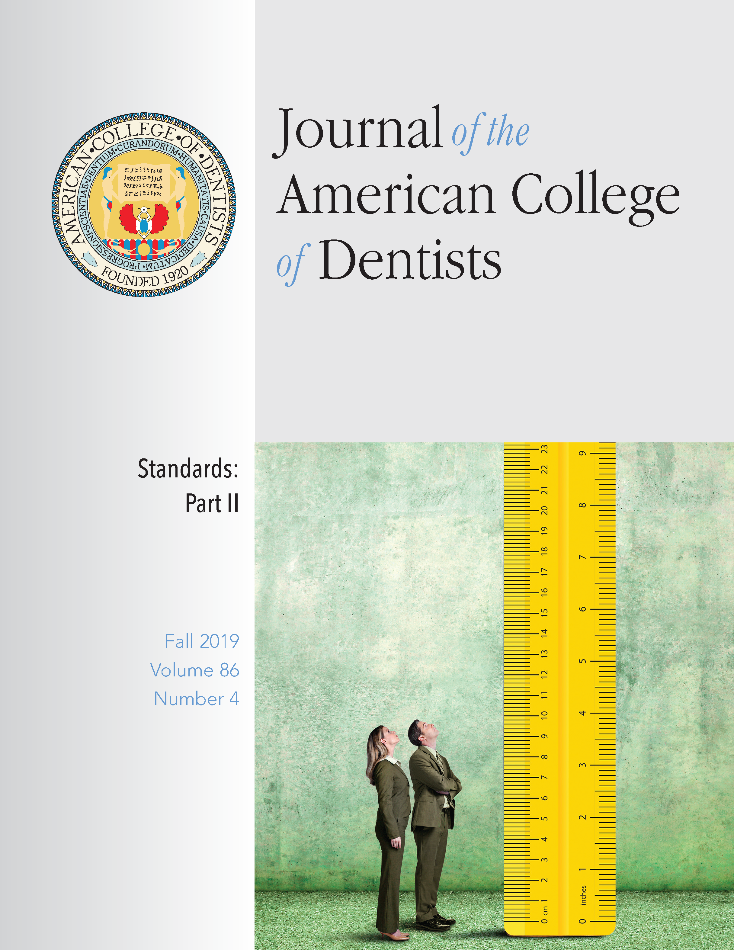 Photo of two professionals looking up at a ruler