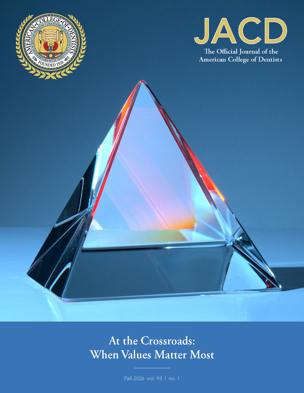 Image of a glass prism set on a flat surface, reflecting light and color within the glass.