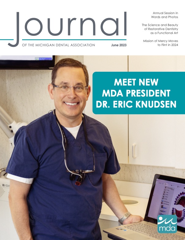 Cover of the Journal of the Michigan Dental Association with MDA President Knudsen wearing dark blue scrubs and smiling in a dental office.