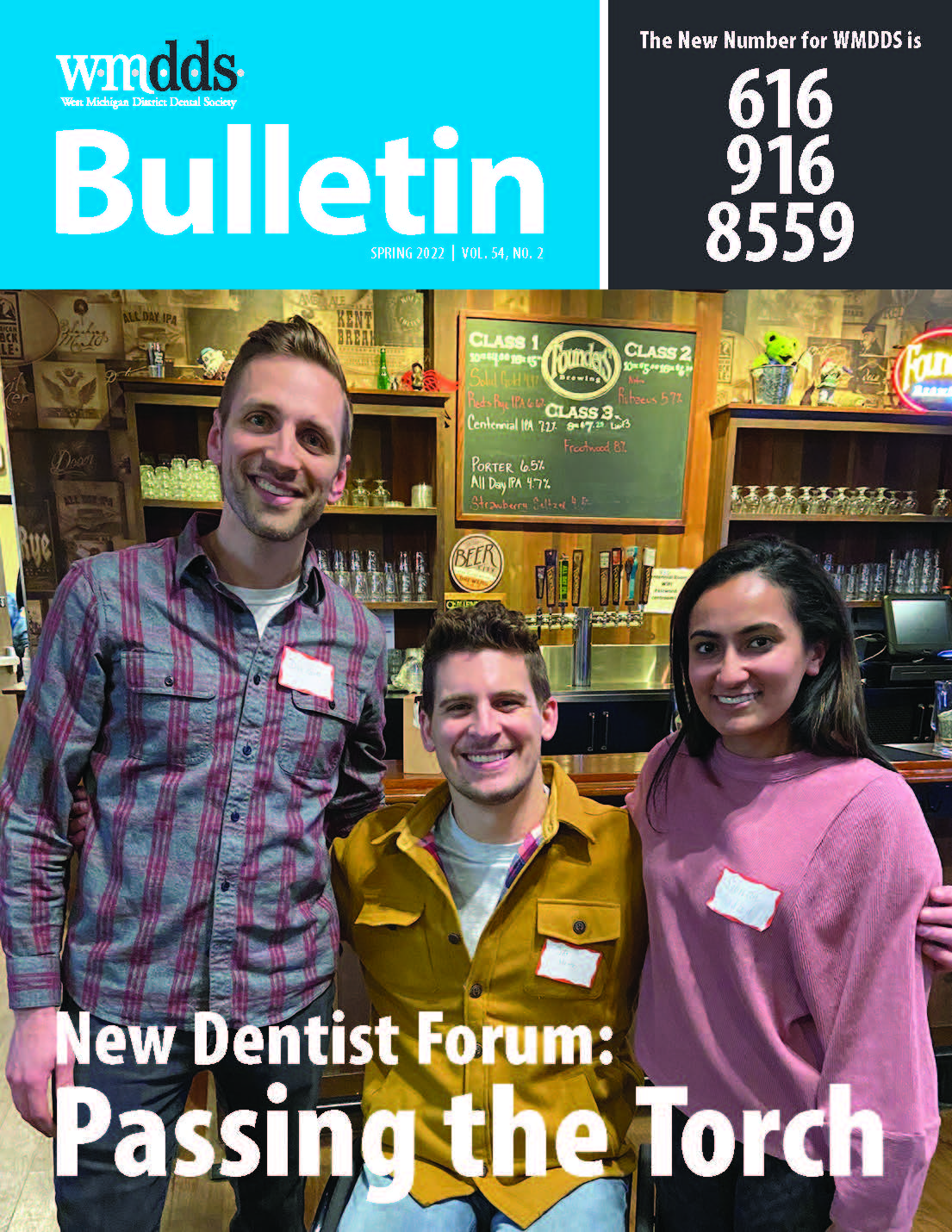 Cover of the WMDDS Bulletin featuring a photo of Drs. Dan Grode, Jeffrey Heinz, and Sabrina Wadood posing with their arms around each other.