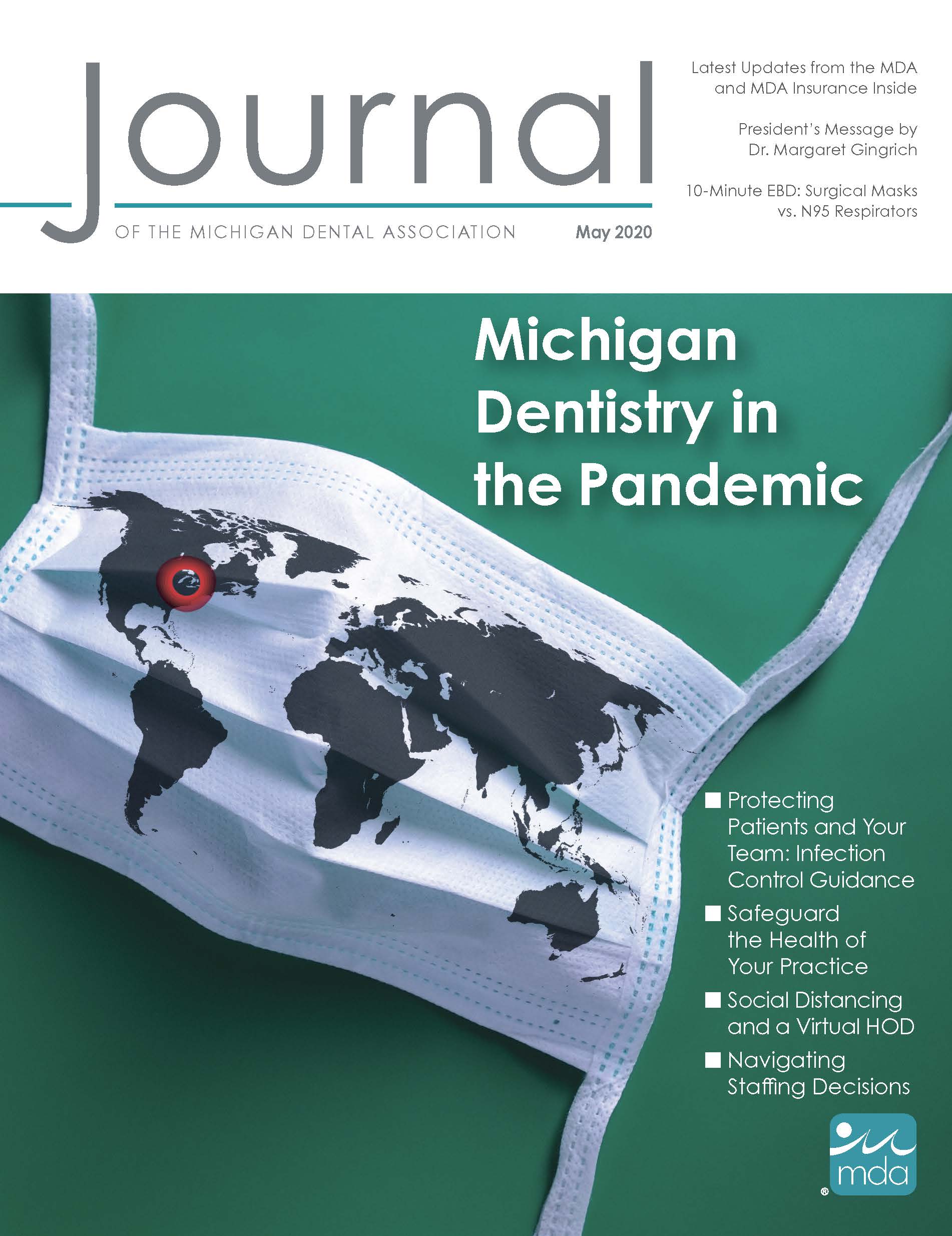 Cover of the Journal of the Michigan Dental Association with a facemask with the world map overlaid on it. Michigan is circled.
