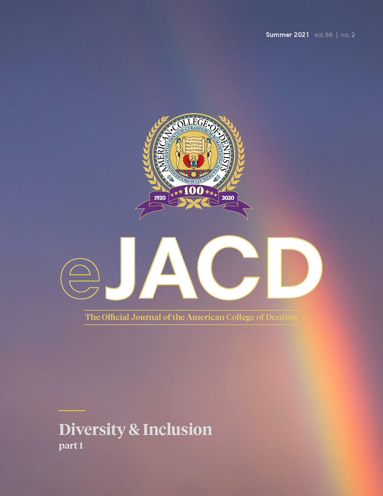 The ACD 100th anniversary sigil in front of a photo of a rainbow