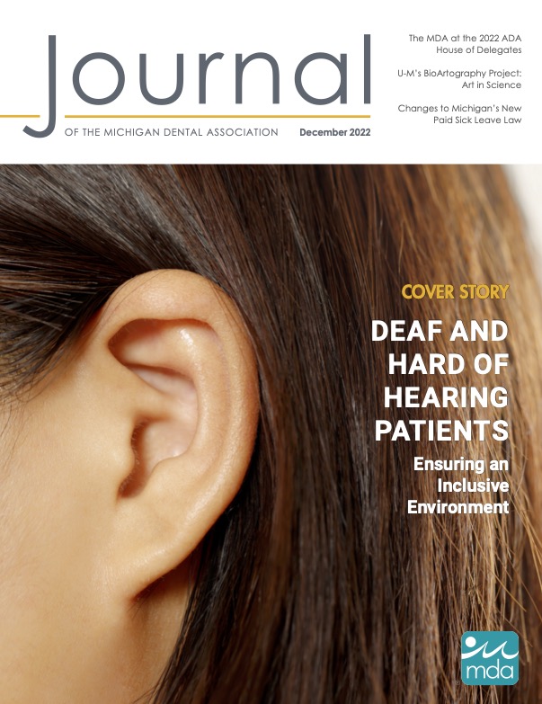 Cover of the Journal of the Michigan Dental Association featuring a person's ear.