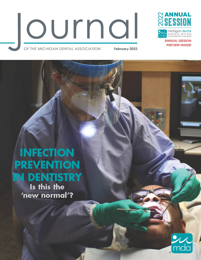 Cover of the Journal of the Michigan Dental Association featuring a dentist with a mask and face shield PPE performing an examination of an adult patient.
