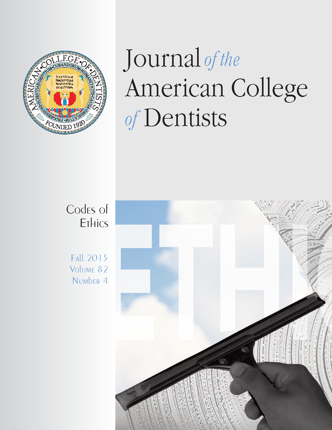 Photo of a window being squeegeed to reveal the word 