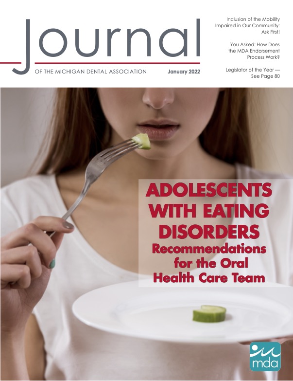 Cover of the Journal of the Michigan Dental Association with a picture of a young person holding a plate with one cucumber slice on it, with a piece cut off and lifted halfway to the person's mouth