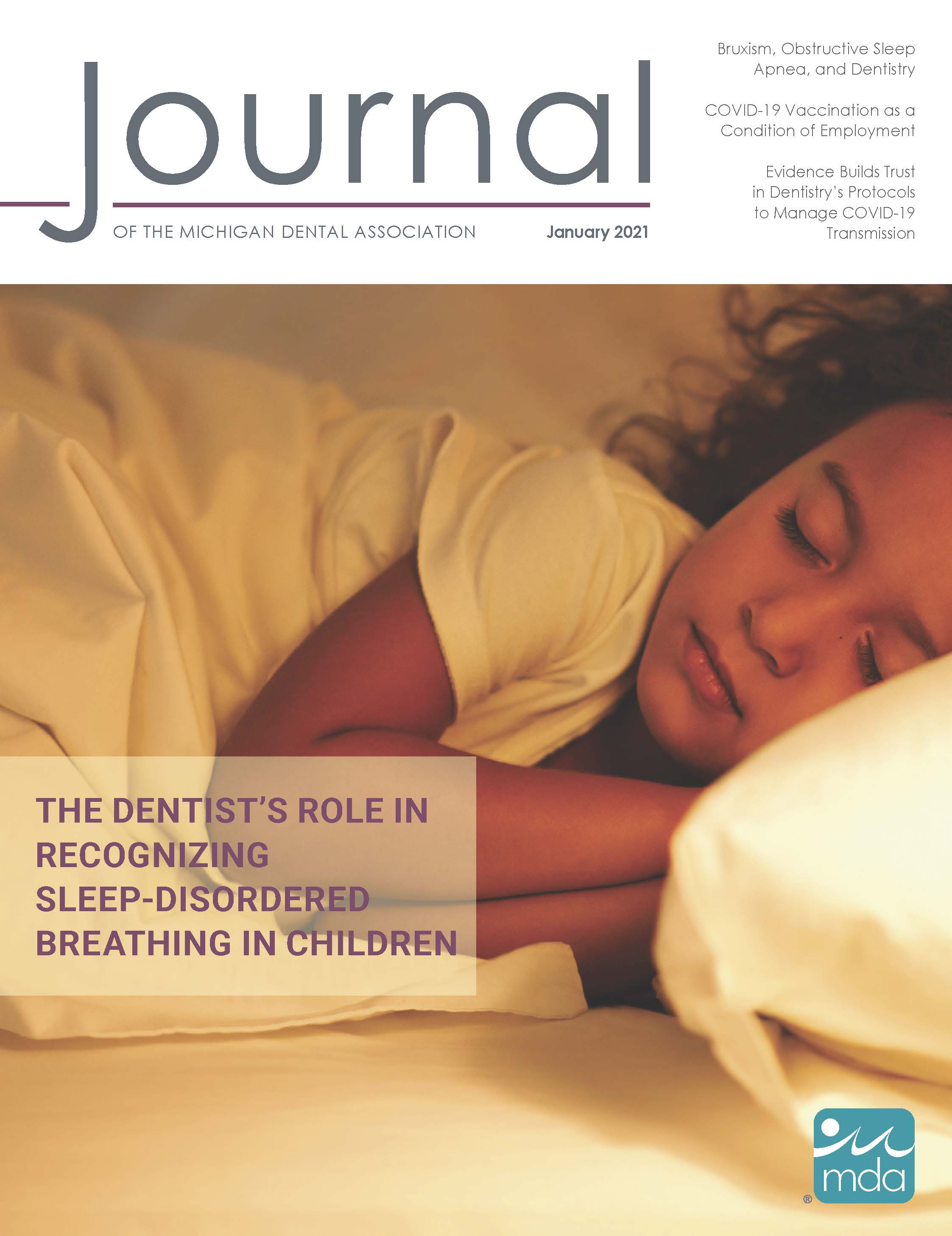 Cover of the Journal of the Michigan Dental Association with a sleeping child.