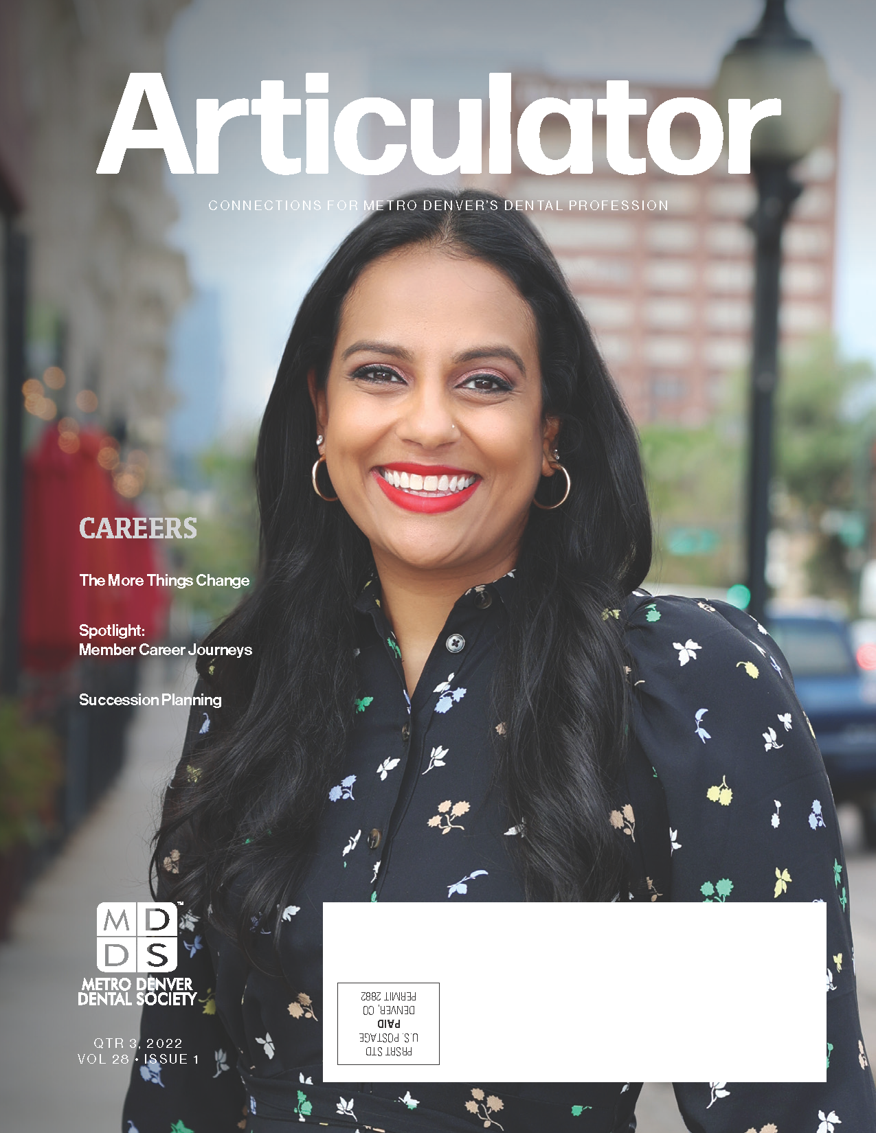 Cover of the Metro Denver Dental Society's Articulator magazine with photograph of Dr. Amisha Singh smiling while standing outside in downtown Denver.