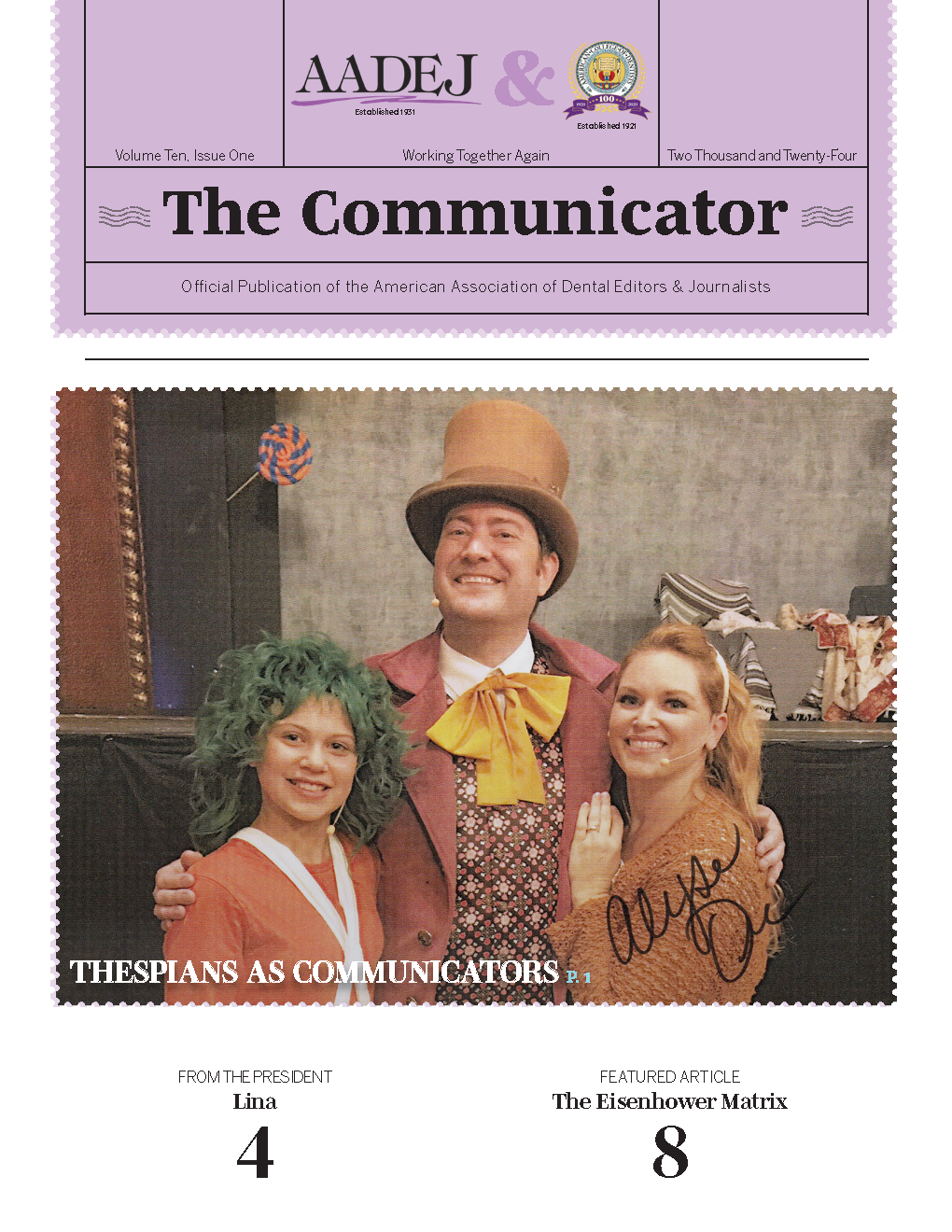 Photo of three Willy Wonka cast members pose together, it is signed 