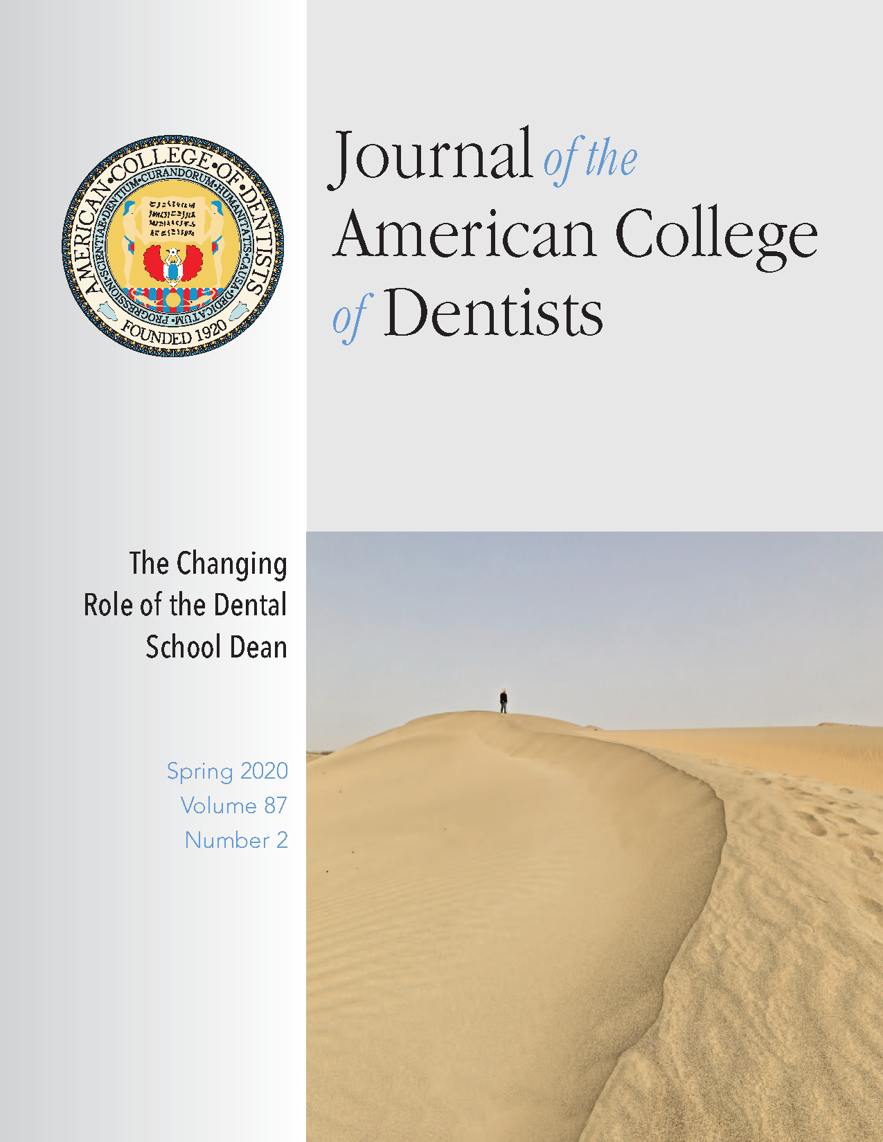 Distance photo of a person walking along a sand dune