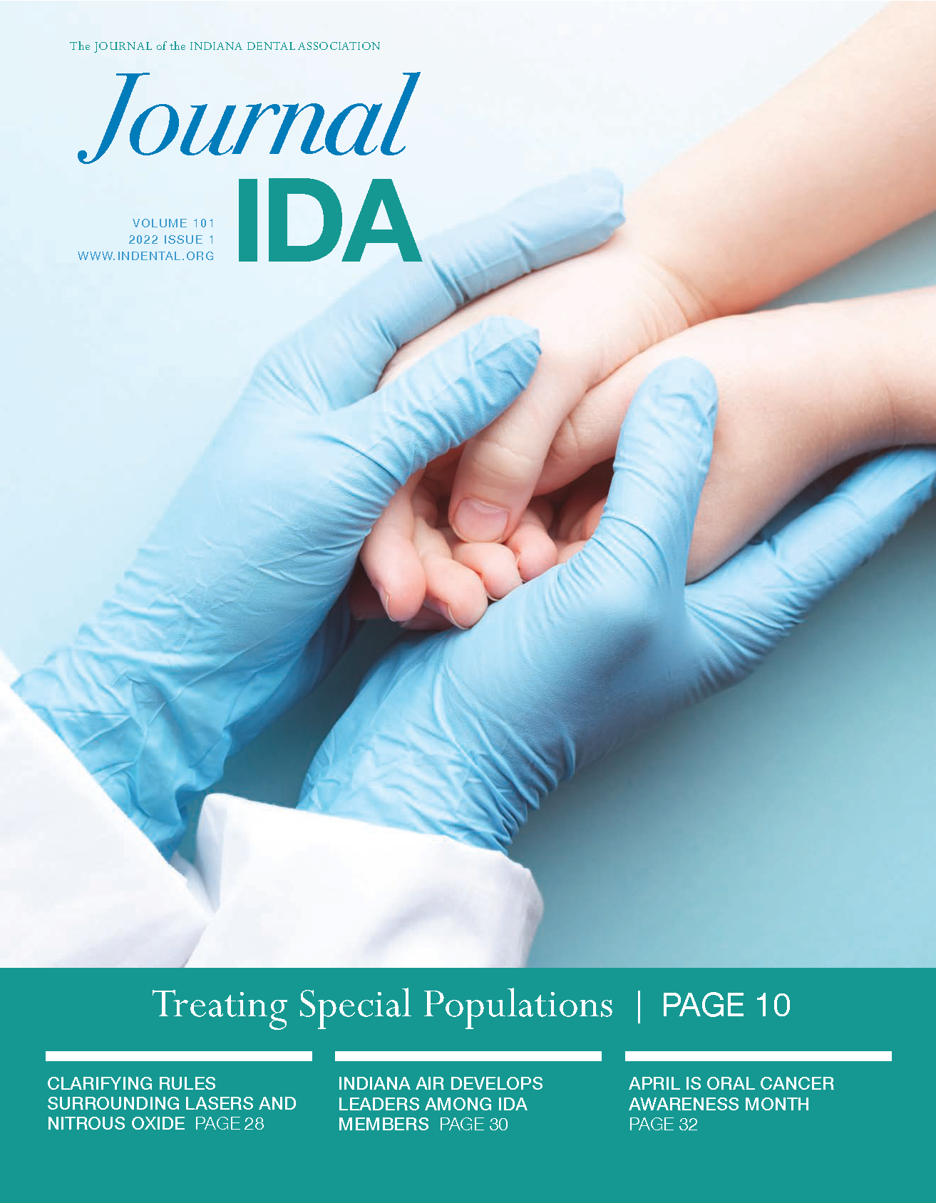 Two hands wearing medical gloves holding the hands of a child