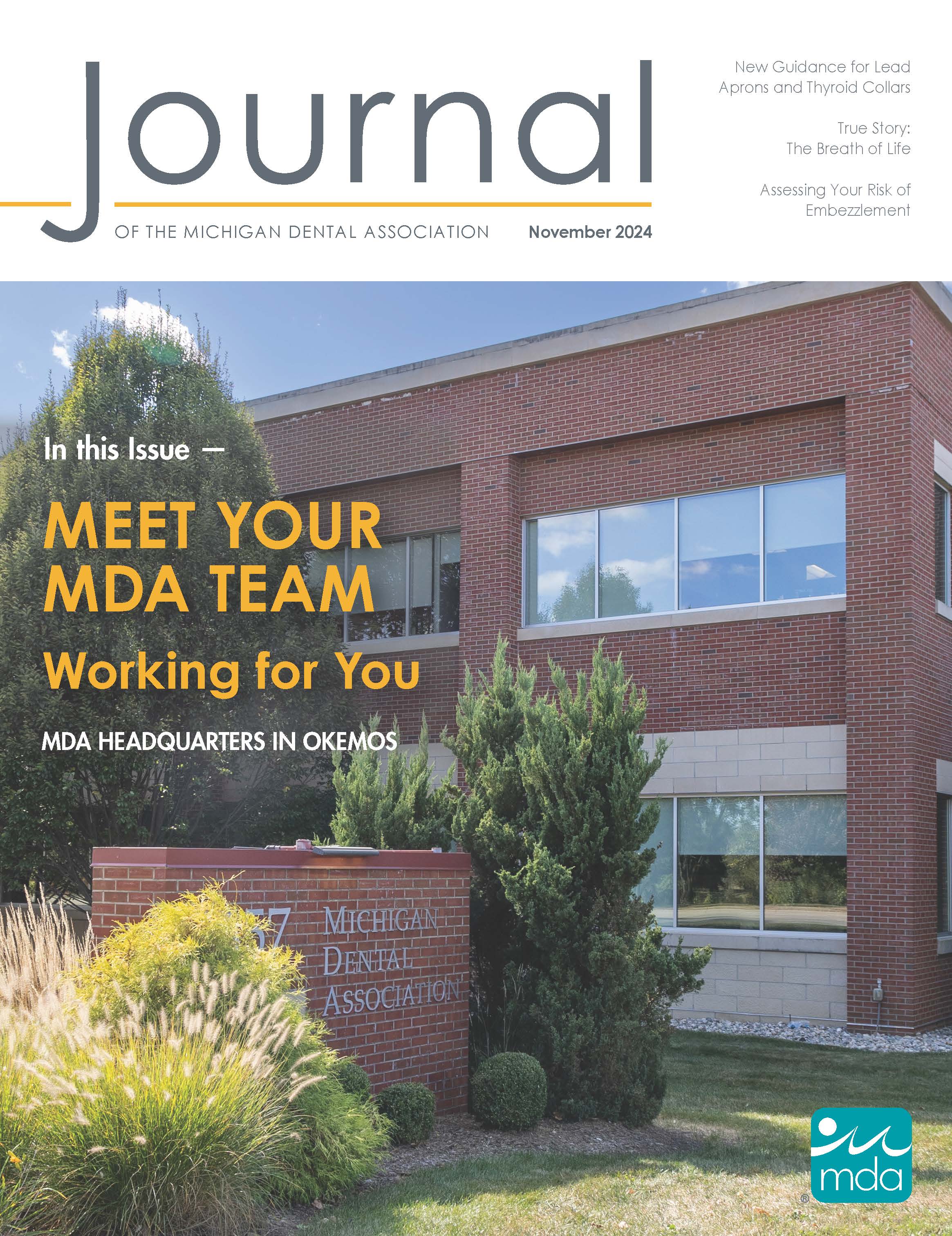 Cover of the Journal of the Michigan Dental Association featuring the front of the Michigan Dental Association building which is two stories and made of brick and glass windows.