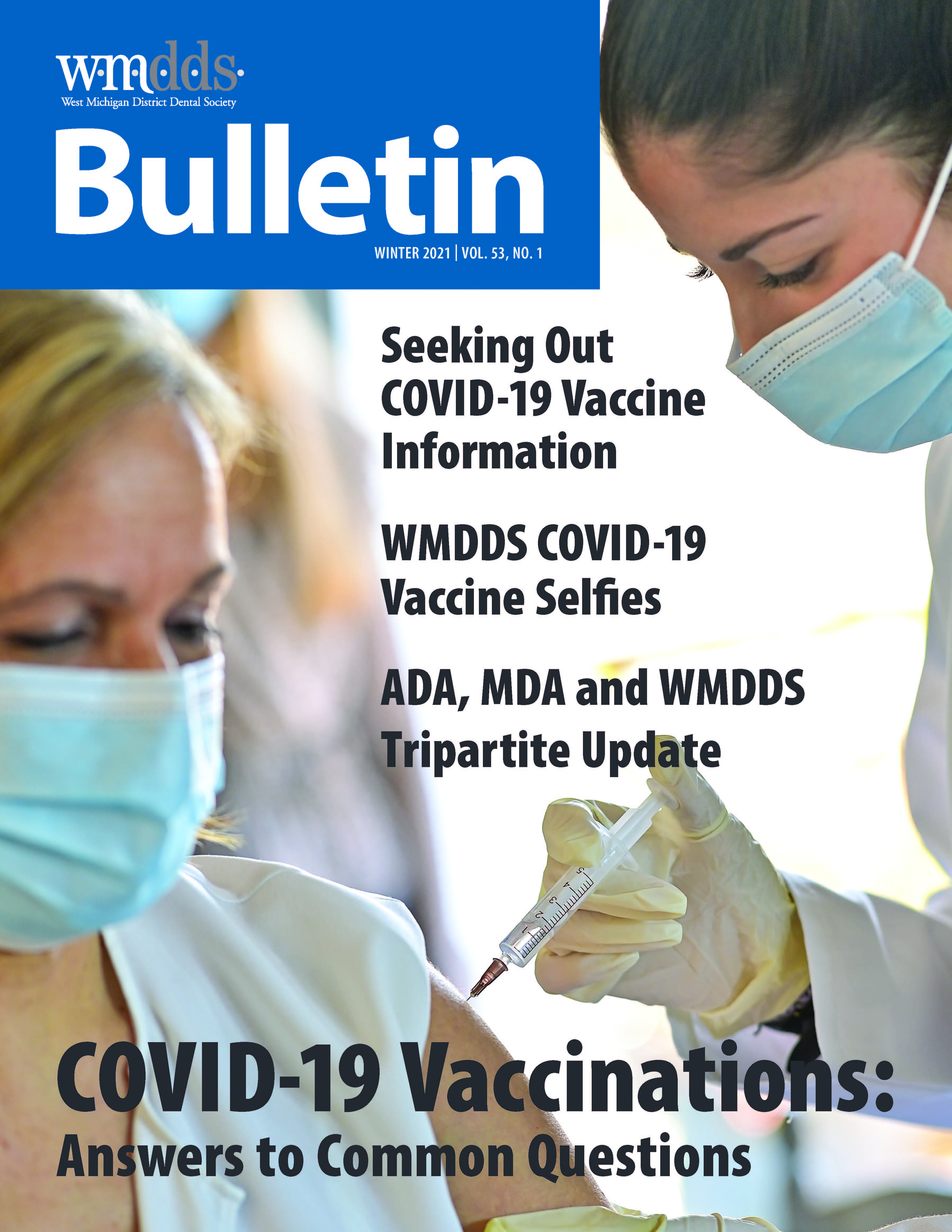 Cover of the WMDDS Bulletin featuring a photo of a person getting a shot from another person in PPE.