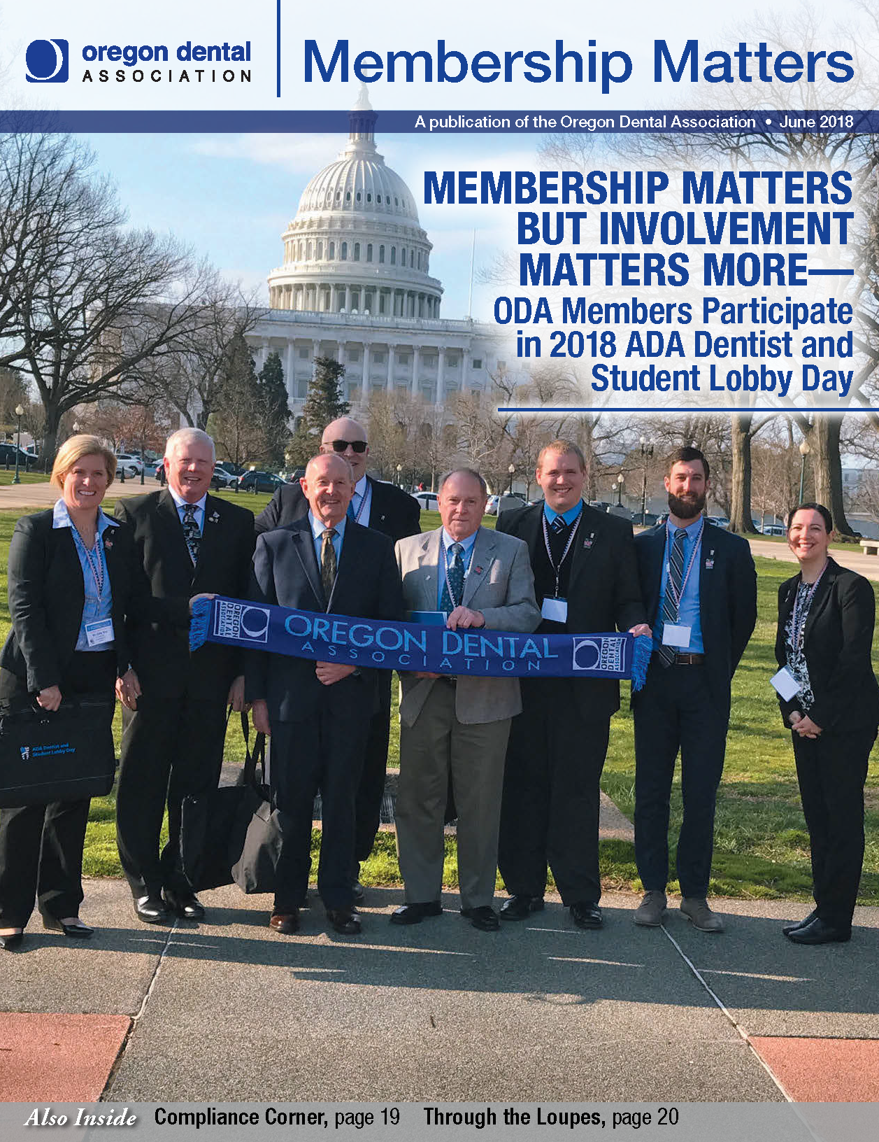 Photo of ODA members in front of the US capitol building holding a large scarf which reads
