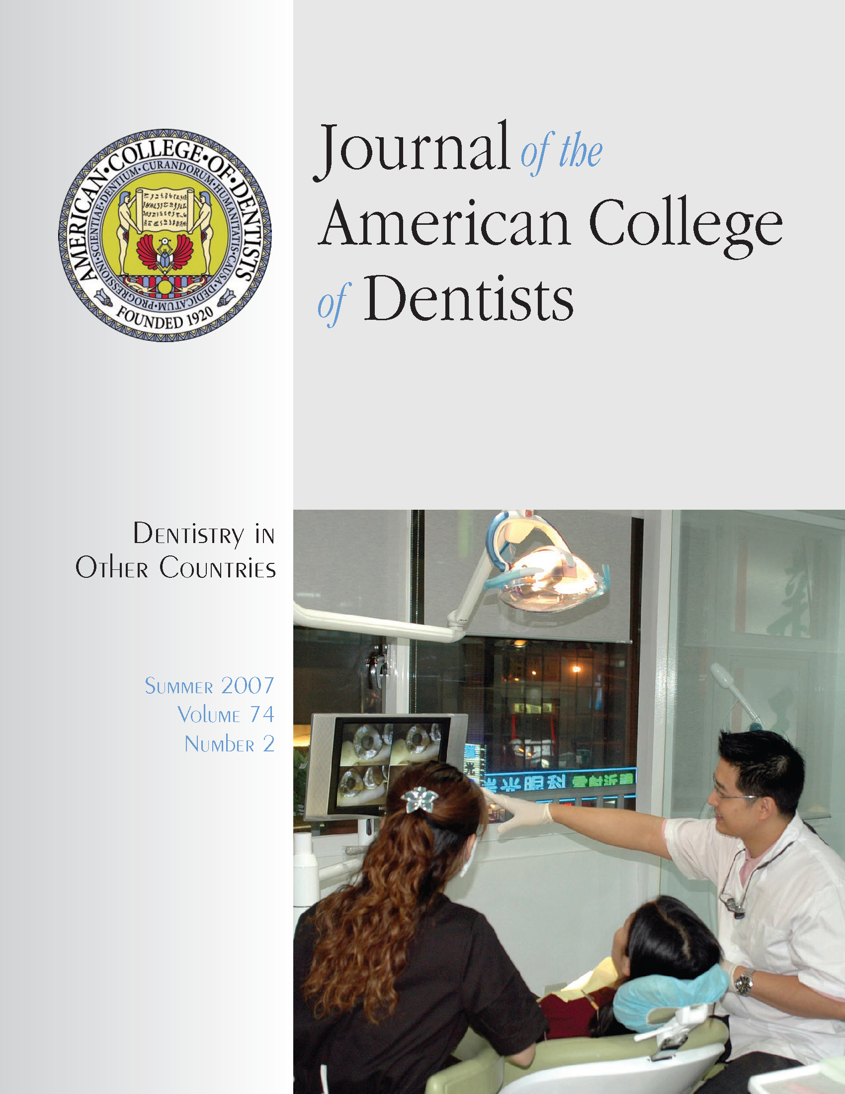 A dentist in Taiwan discusses x-rays with a young patient and her mother