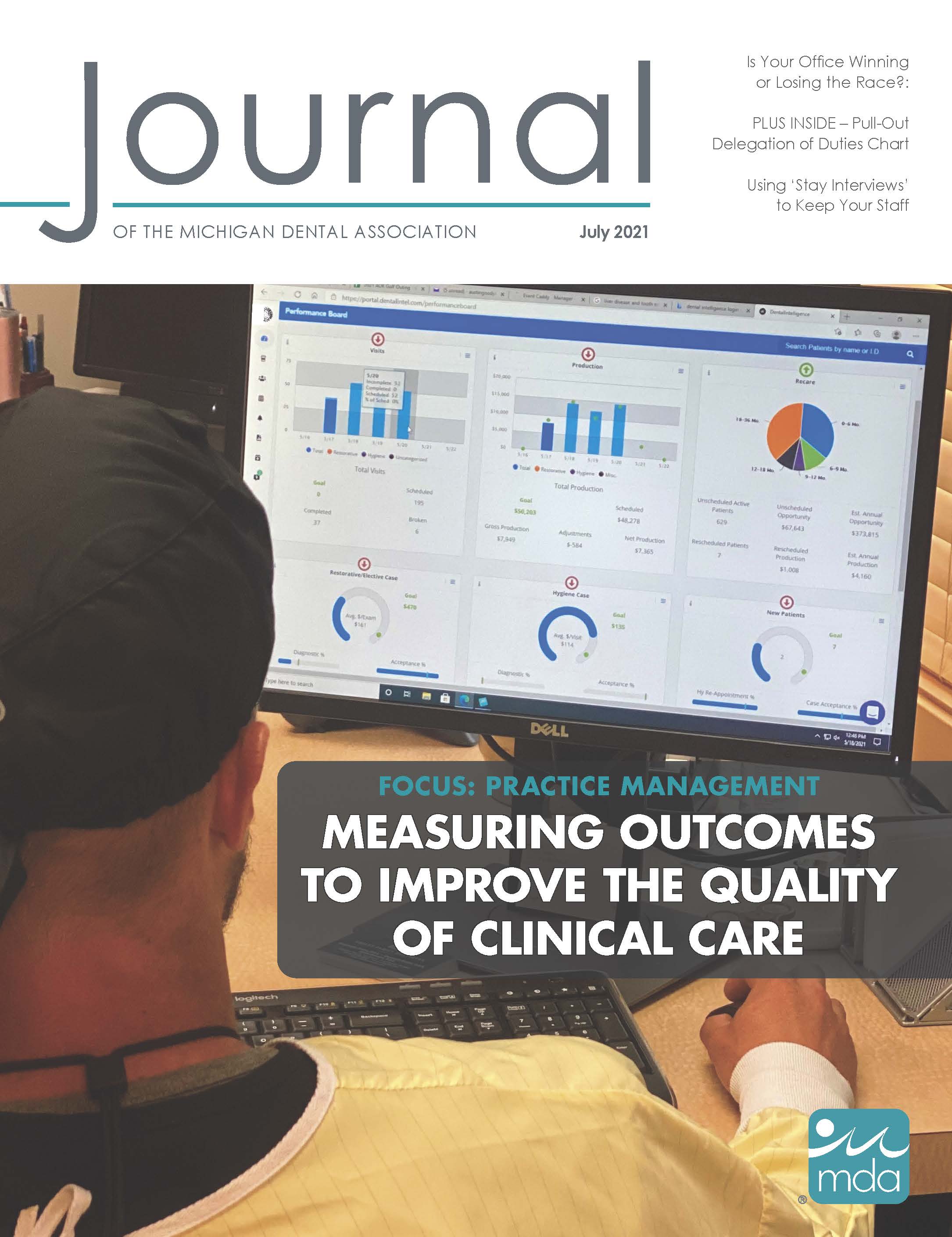 Cover of the Journal of the Michigan Dental Association with an over-the-shoulder photo of a computer dashboard with multiple charts.