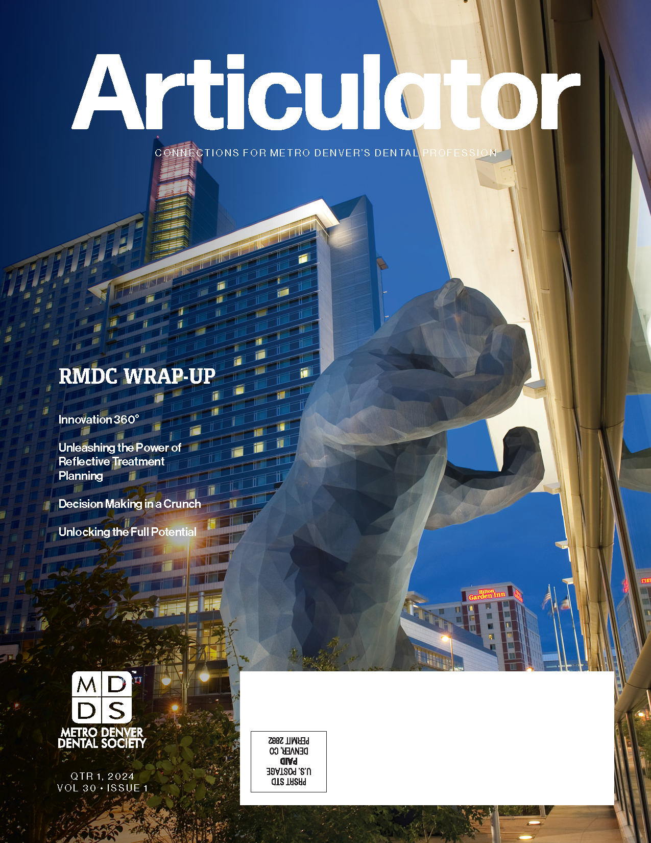 Cover of the Metro Denver Dental Society's Articulator magazine with image of a statue of a bear and high rise buildings in downtown Denver in the background.