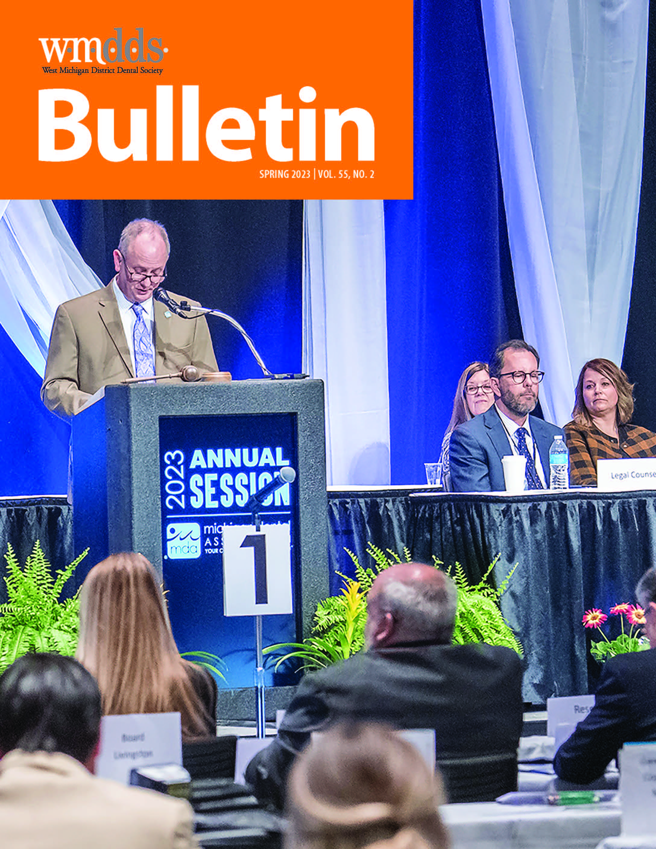 Cover of the WMDDS Bulletin with a photo of MDA Speaker of the House, Dr. Todd Christy, presiding over the 2023 MDA House of Delegates