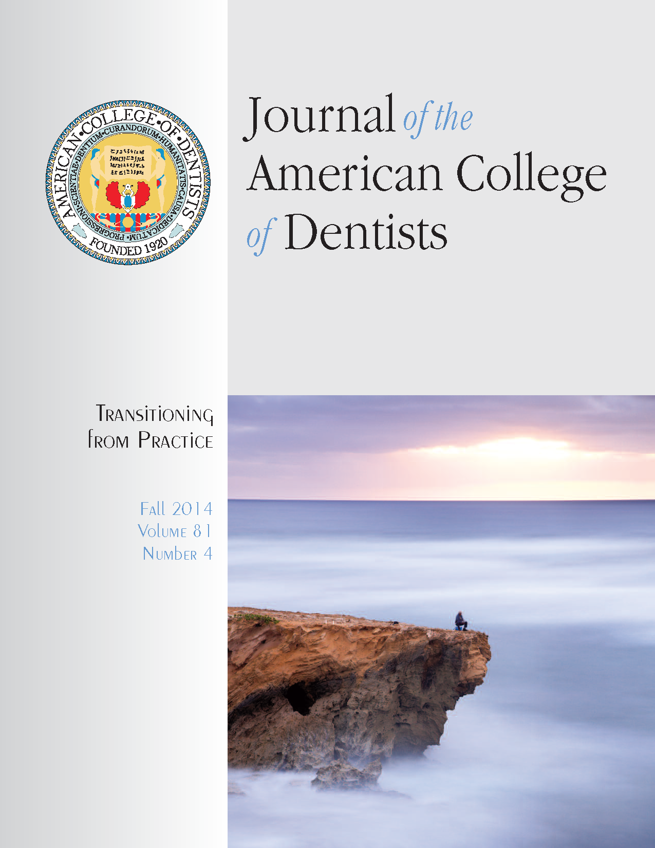 Distant photograph of a person sitting on a cliff with fog beneath them