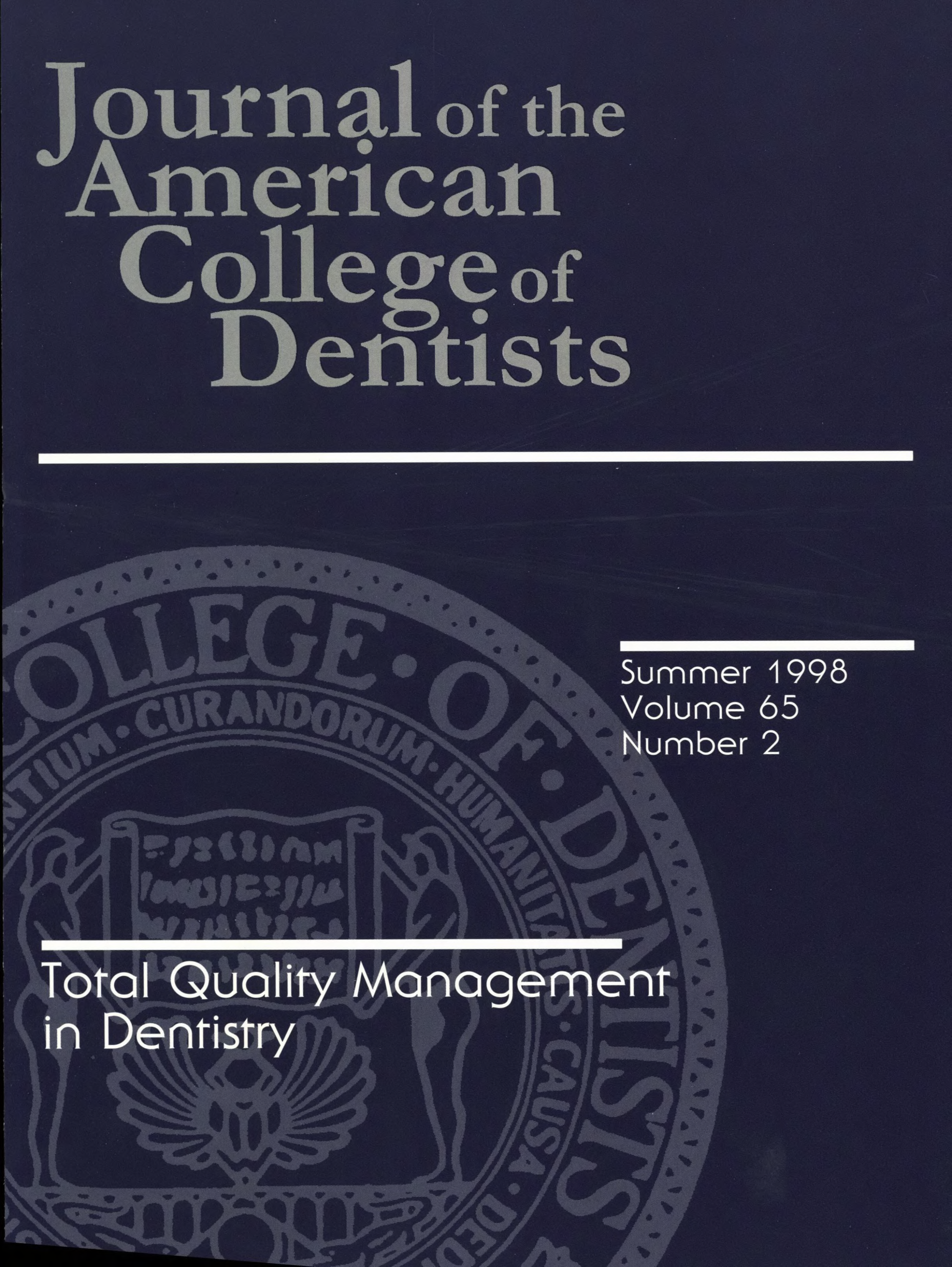 Dark blue JACD cover with a large, light gray ACD seal in the background